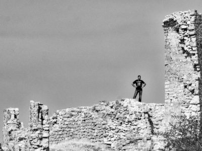 A Dark Clad Figure Upon the Castle Wall